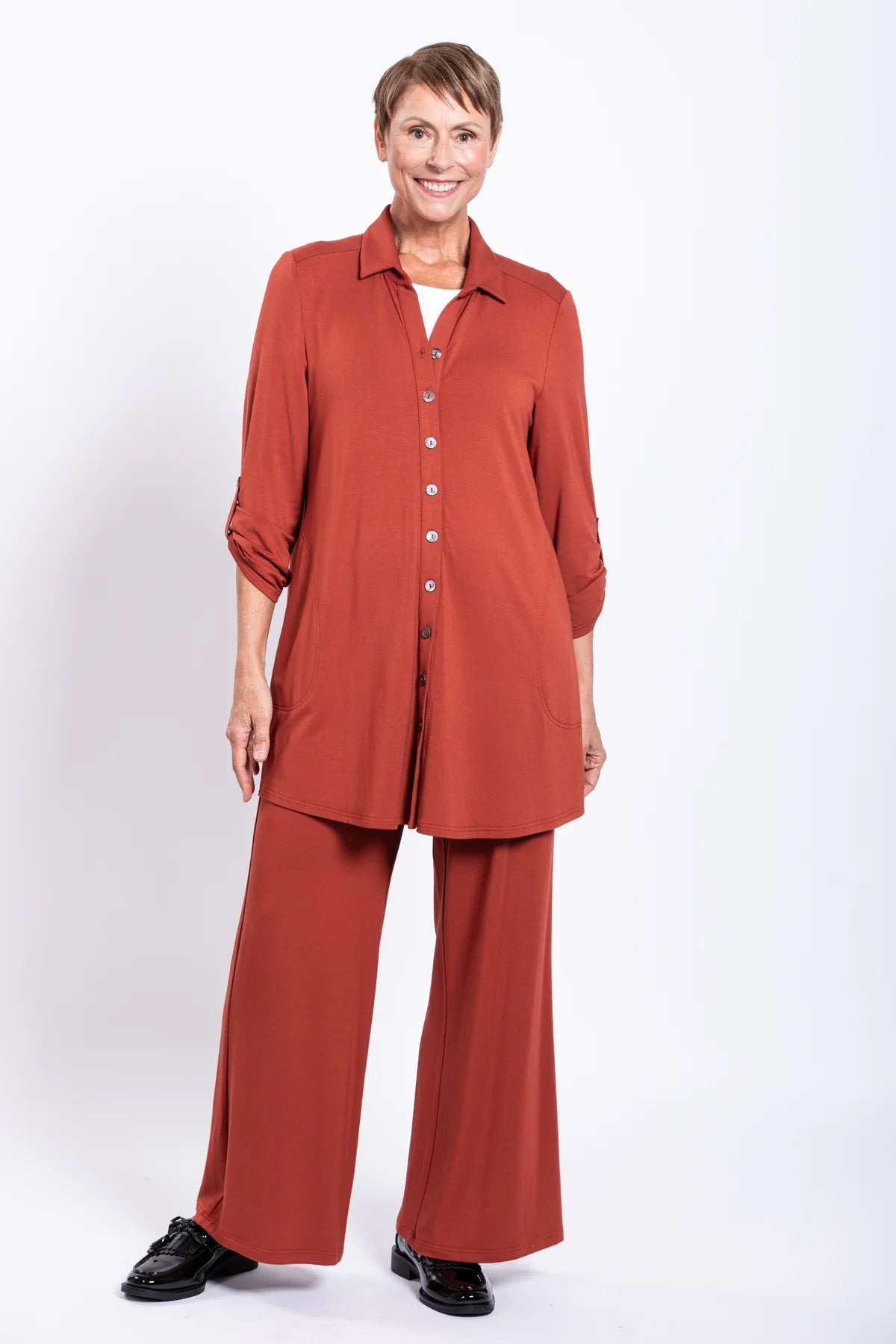 Woman wearing a red outfit with a white background