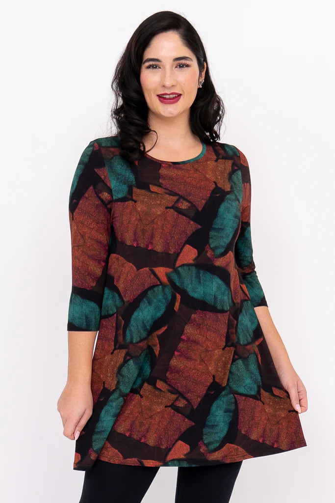 Woman wearing a patterned dress on a white background