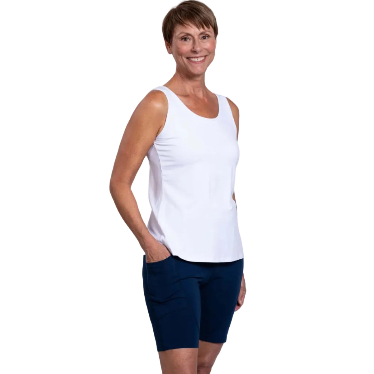 Woman wearing blue sky robson bamboo shorts in the colour indigo on a white background.