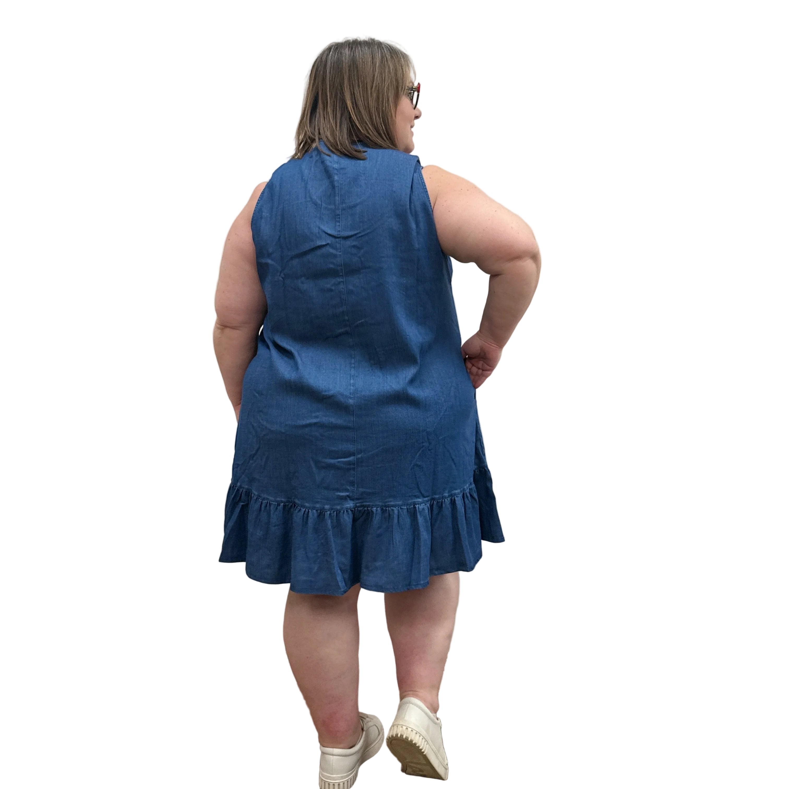 Woman wearing a Denim Blue Sky Lali Dress on white background. 