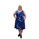 Woman wearing a blue patterned Blue Sky Sara Dress on white background. 