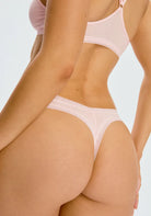 Micro Thong in Soft Pink panty on a model shown from the back view. 