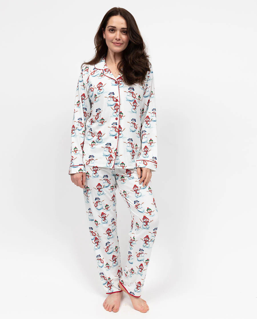 Woman wearing a patterned pajama set on a white background