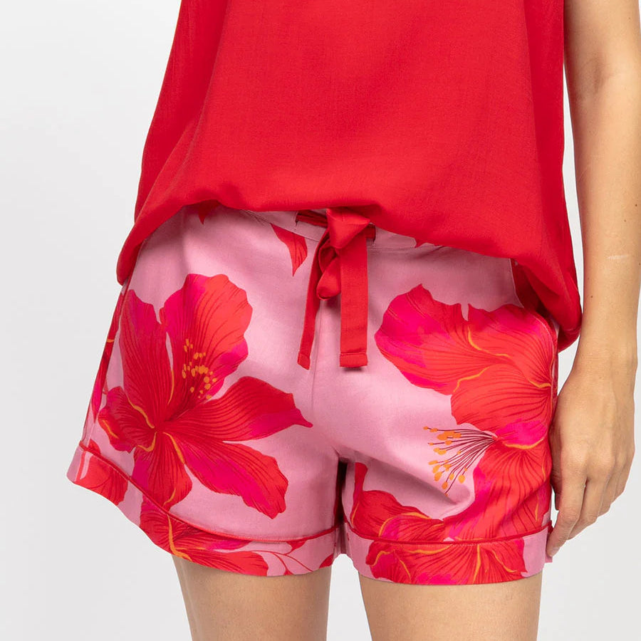 cyberjammie pippa slouch top and shorts pajama set close up of red top and hibiscus pink and red floral pajama shorts with white background