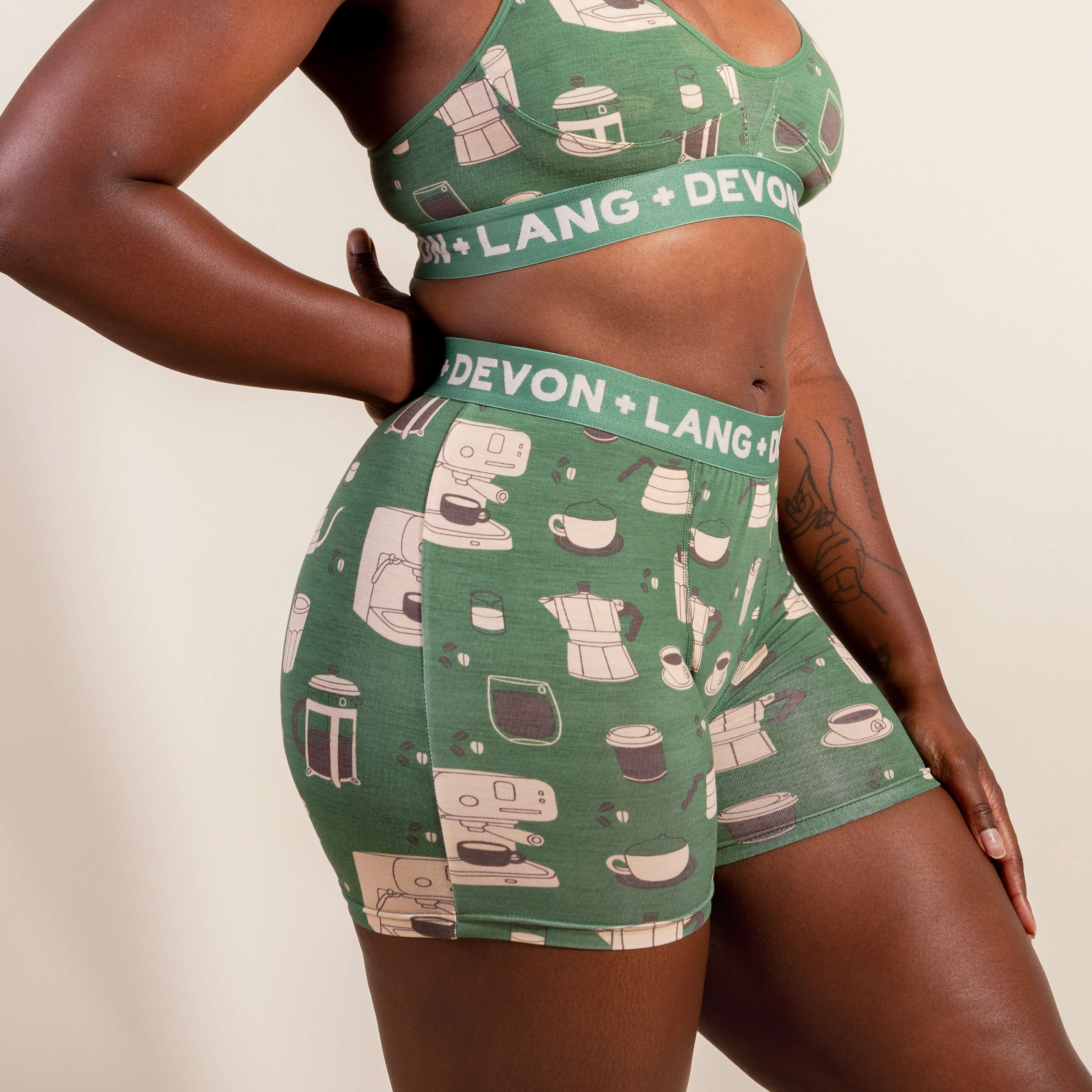 Green bralette and shorts set with 'Devon + Lang' branding on a beige background