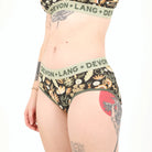 Floral patterned underwear with 'Devon + Lang' waistband on a white background
