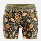 Floral-patterned boxer briefs with a green Devon + Lang waistband on a white background