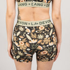 Floral patterned underwear with brand name on waistband against a neutral background