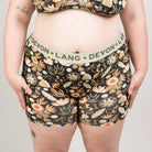 Floral patterned underwear with ''Devon + Lang'' waistband on a plain background
