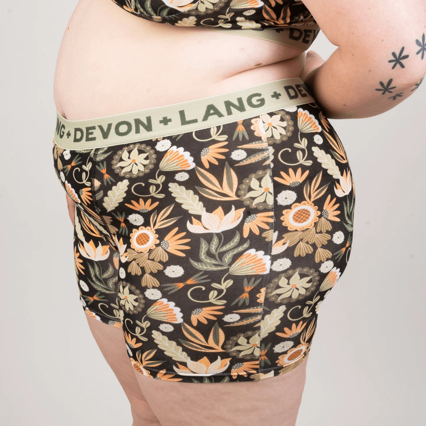 Floral-patterned underwear with 'Devon + Lang' waistband on a plain background