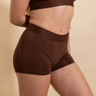 Brown underwear with brand logo on a beige background