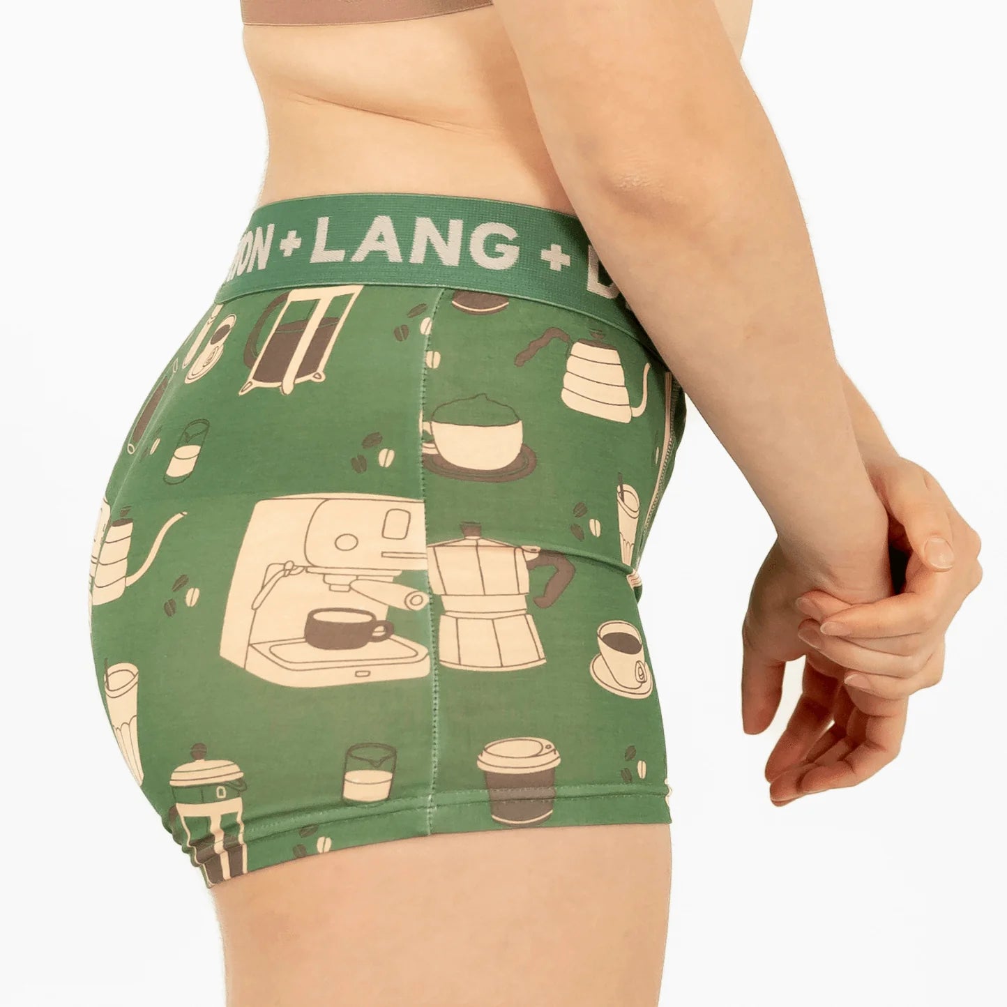 Green underwear with coffee-themed design and 'Devon + Lang' waistband on a white background