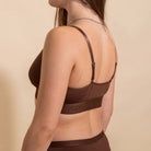 Brown bra with 'Devon + Lang' brand name on a beige background