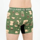 Green boxer briefs with coffee-themed pattern and 'Devon + Lang' branding.