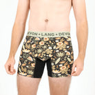 Floral-patterned men's underwear with 'Devon + Lang' waistband on a white background