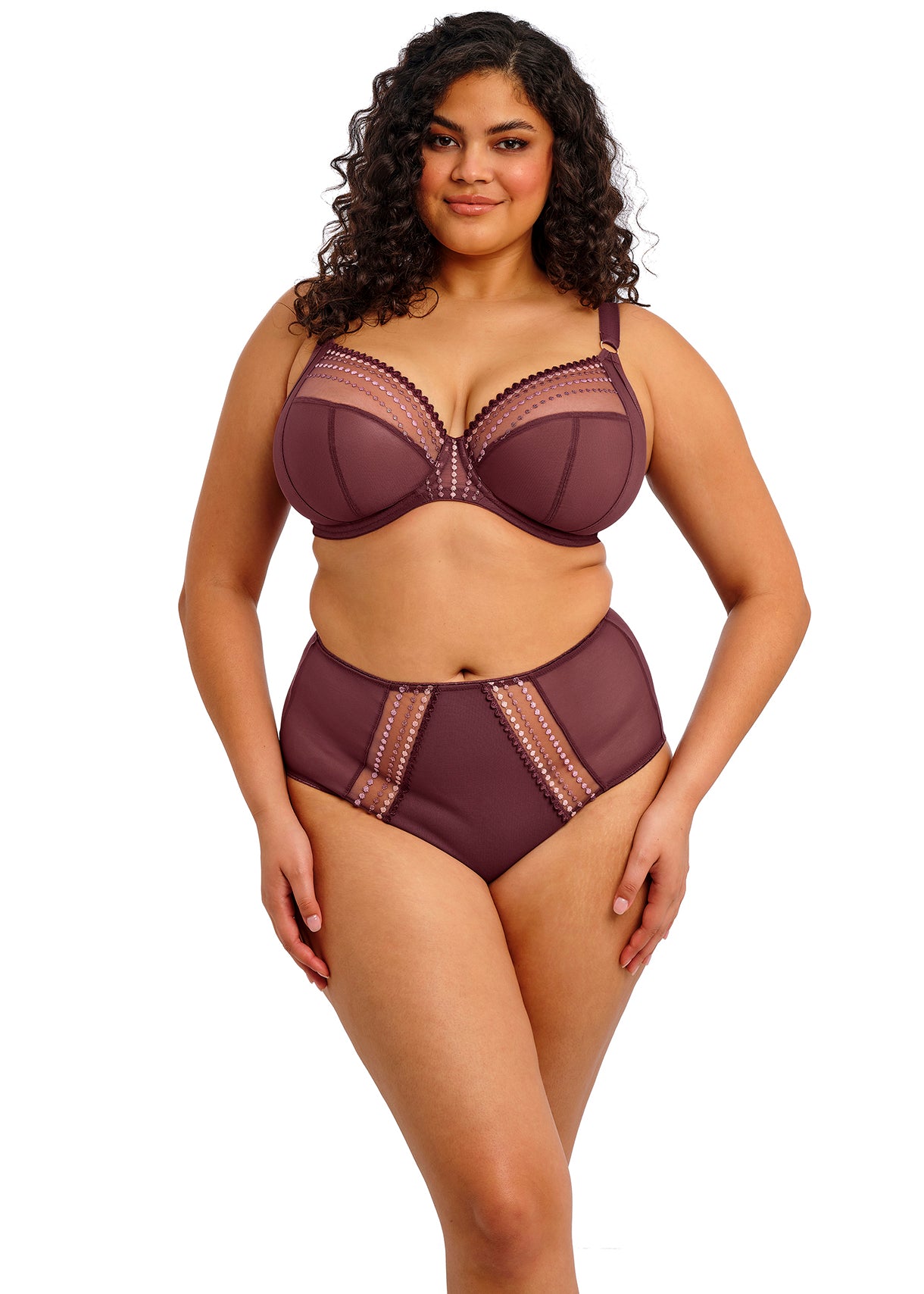 Woman wearing a maroon lingerie set on a white background