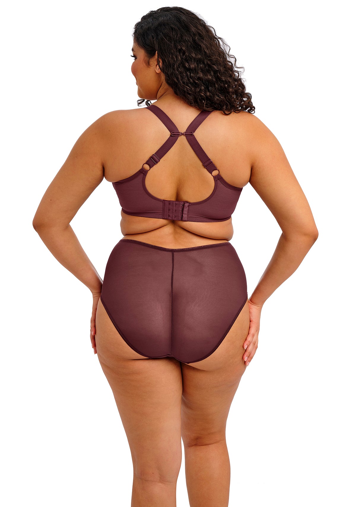 Woman wearing a brown swimsuit with a white background