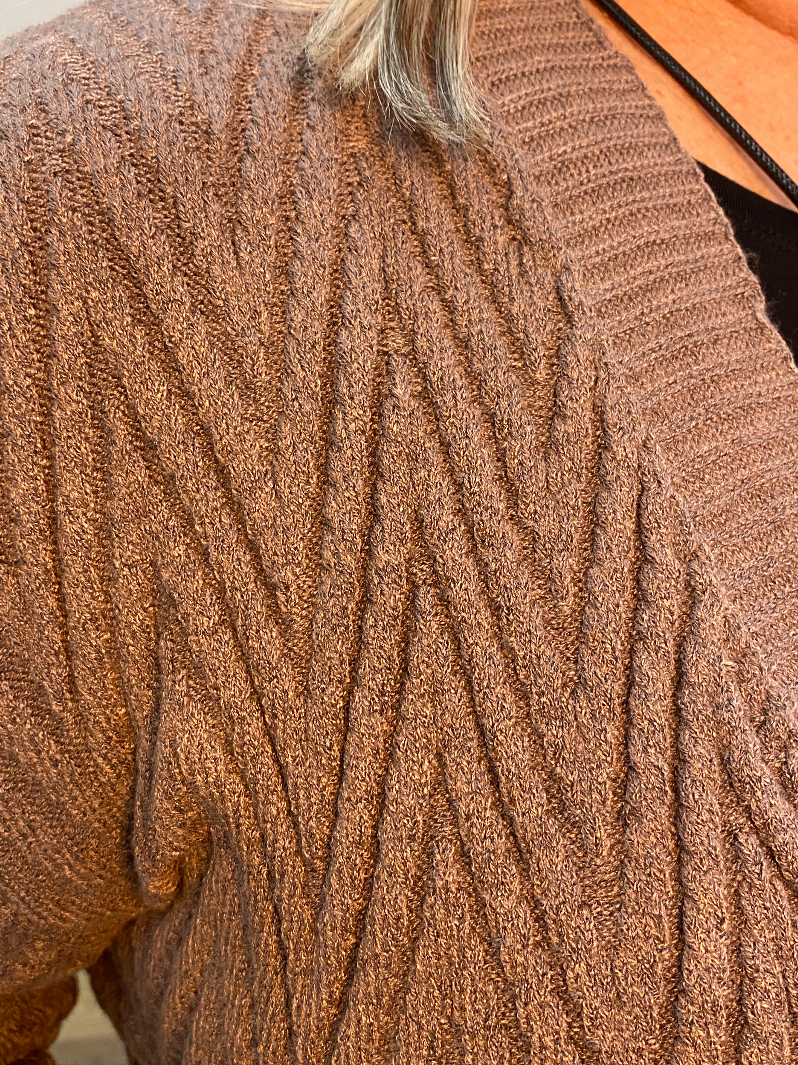 Close-up of grey textured fabric with a blurred background