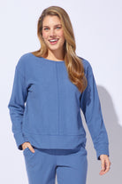 Woman wearing a blue outfit on a white background