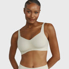 Beyond Bra in Aloe, light sage green wirefree bra shown on a model facing the front. 