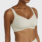 Beyond Bra in Aloe, light sage green wirefree bra on a model from a closer up view. 