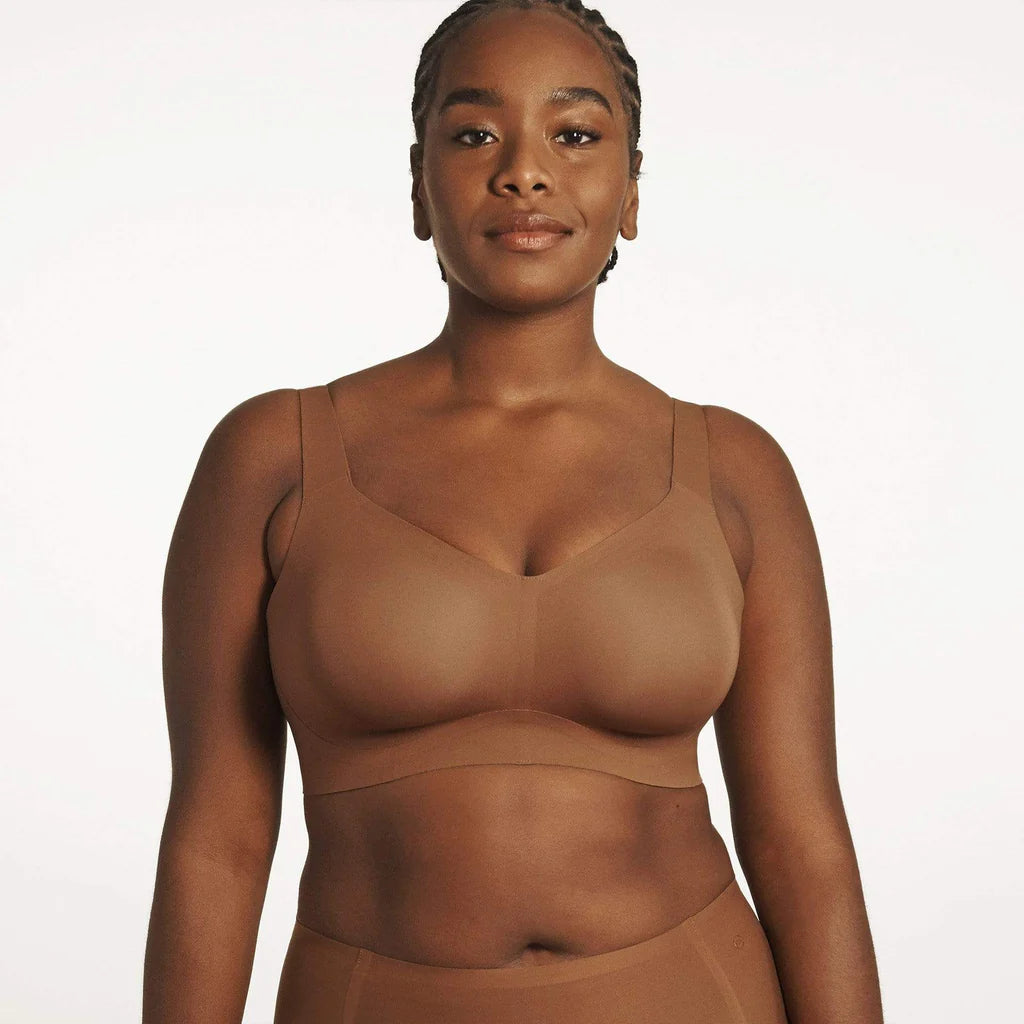 Beyond Bra in Clay, brown wirefree bra shown on a model from the forward view. 
