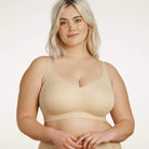 Beyond Bra in Sand, beige wirefree bra shown on a model from the front view. 