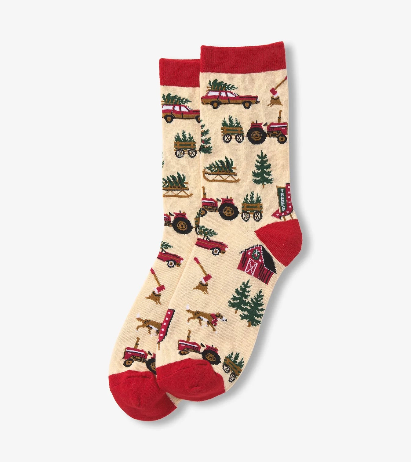 Two socks with a festive design of tractors and Christmas trees on a beige background.