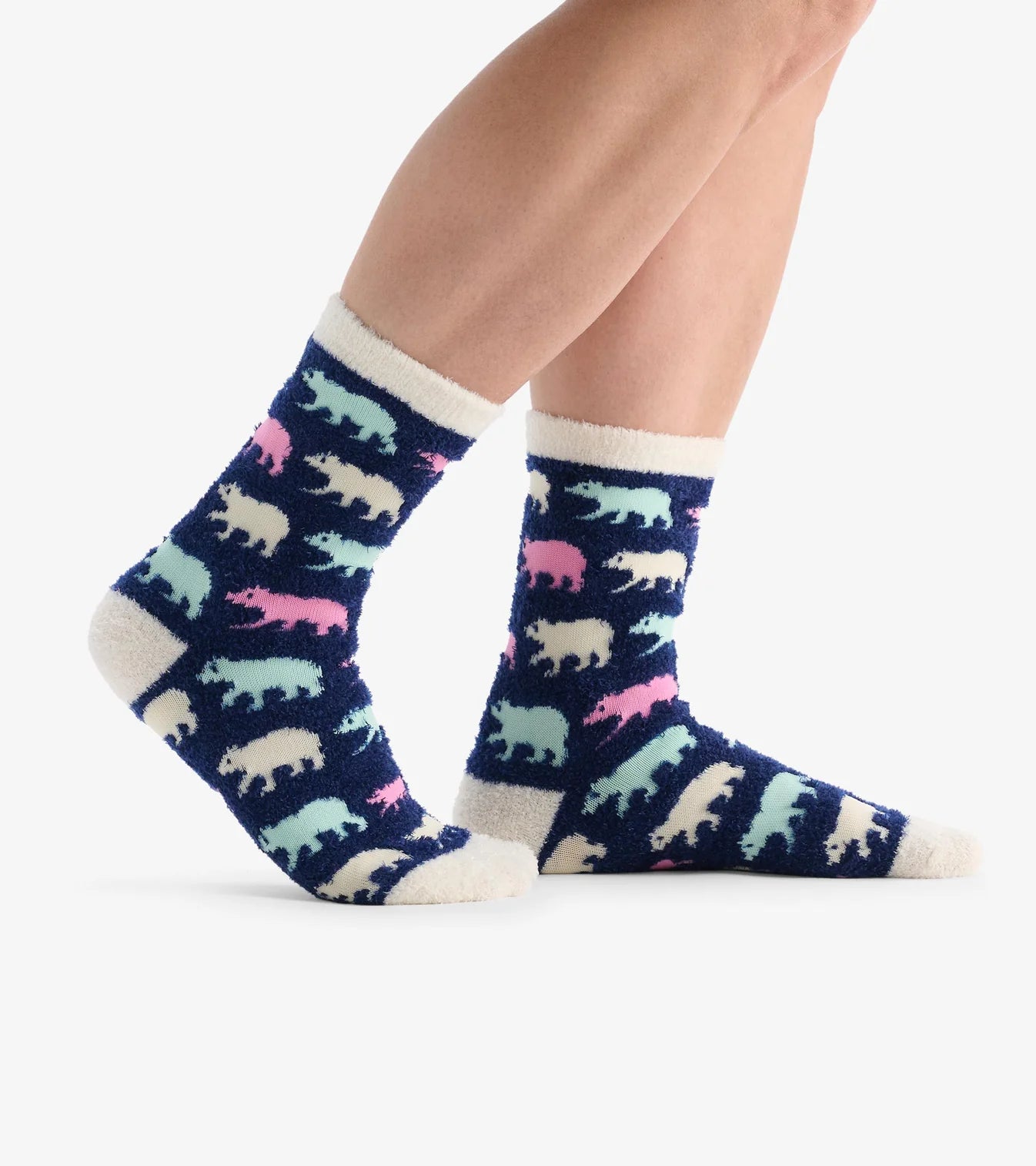 Navy socks with colorful animal pattern worn by a person on a white background