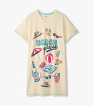 Beige t-shirt with beach-themed graphics and 'BEACH PLEASE' text on a white background