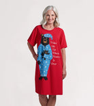 Woman wearing a red nightshirt with a bear design and text on a white background