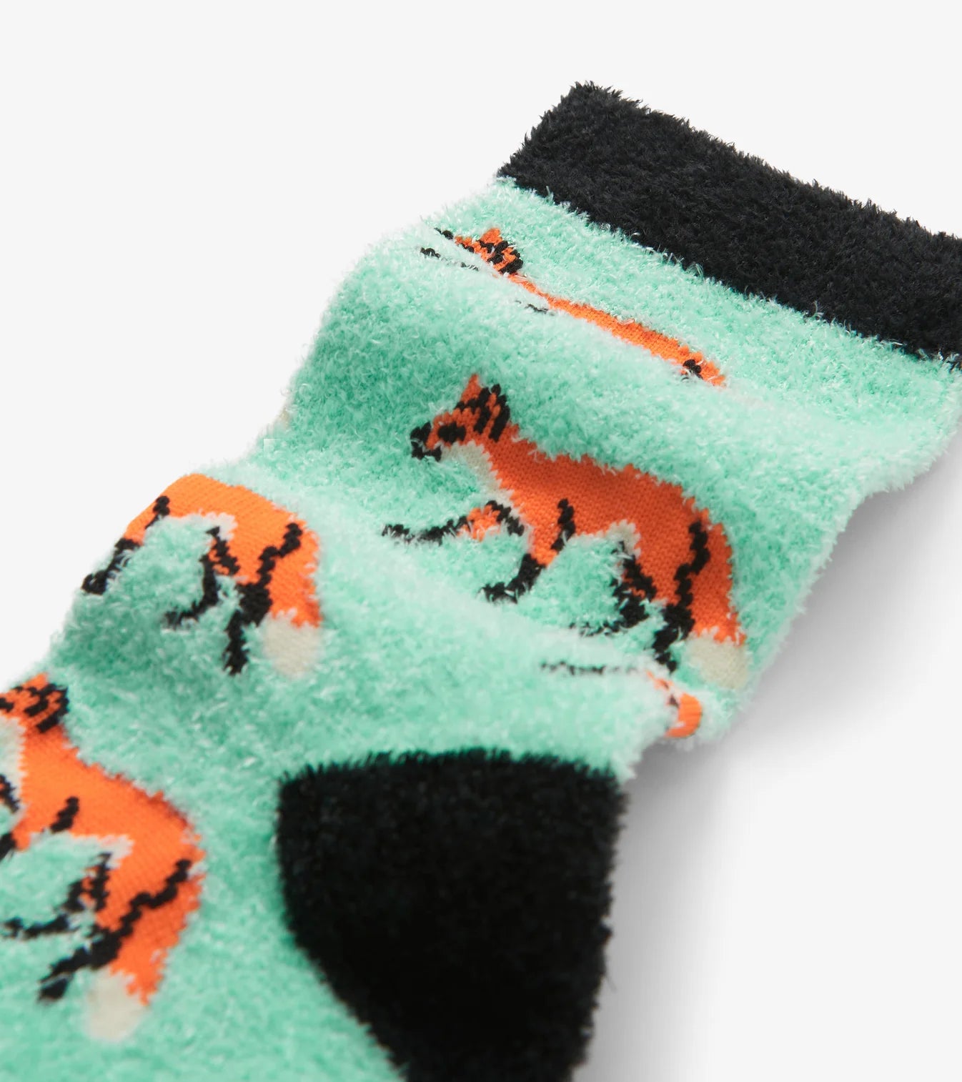 Pair of green socks with orange fox designs on a white background