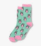 Green socks with pink accents and owl pattern on a white background