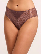 Brown lace underwear on a plain background