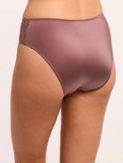 Brown satin underwear with lace trim on a neutral background