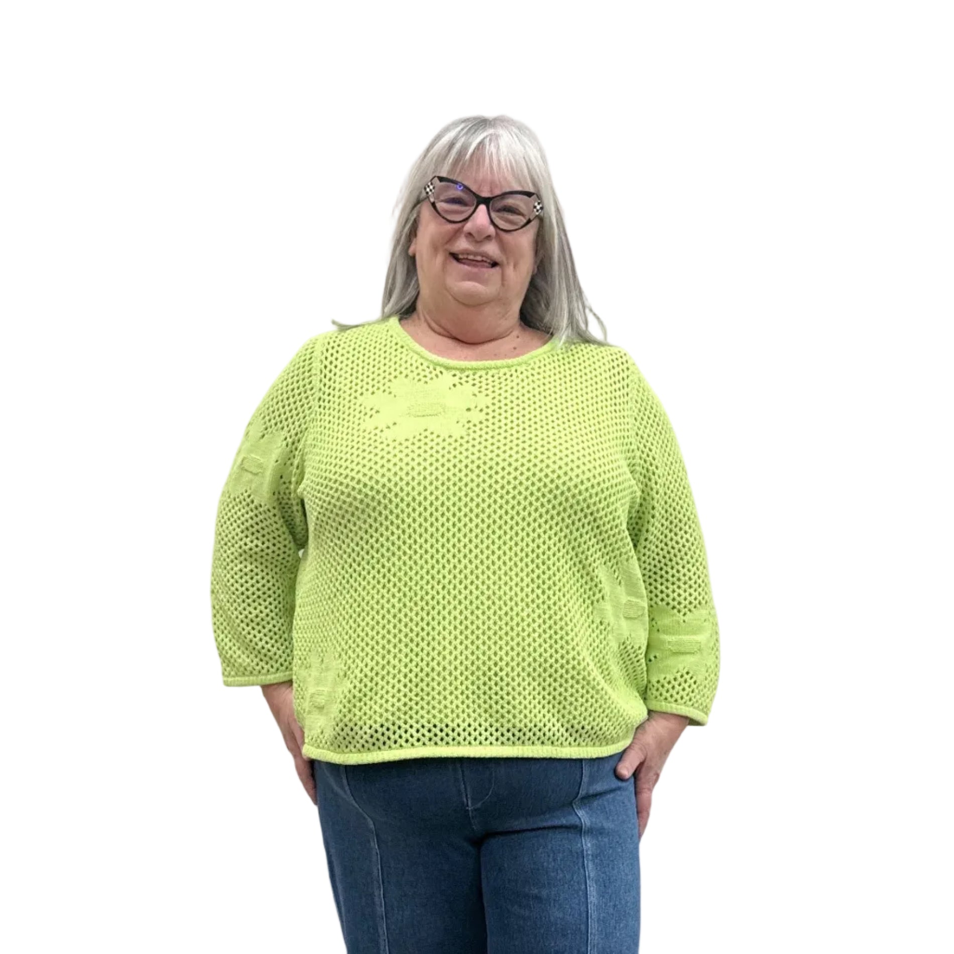 Person wearing a bright green Papa Easy Pullover sweater and blue jeans standing against a plain wall.