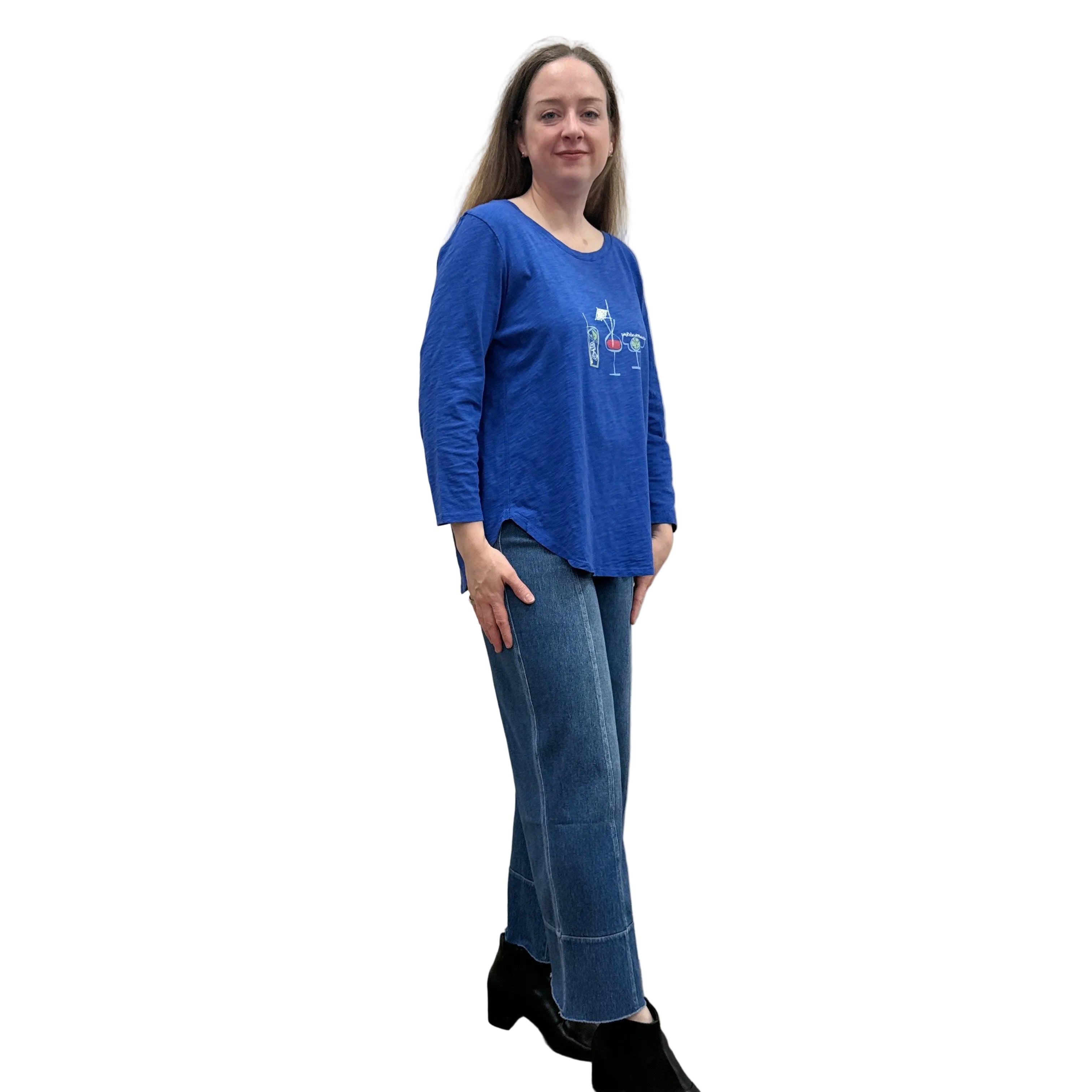 Person wearing a blue Papa High Low longsleeve top and jeans on a white background. 