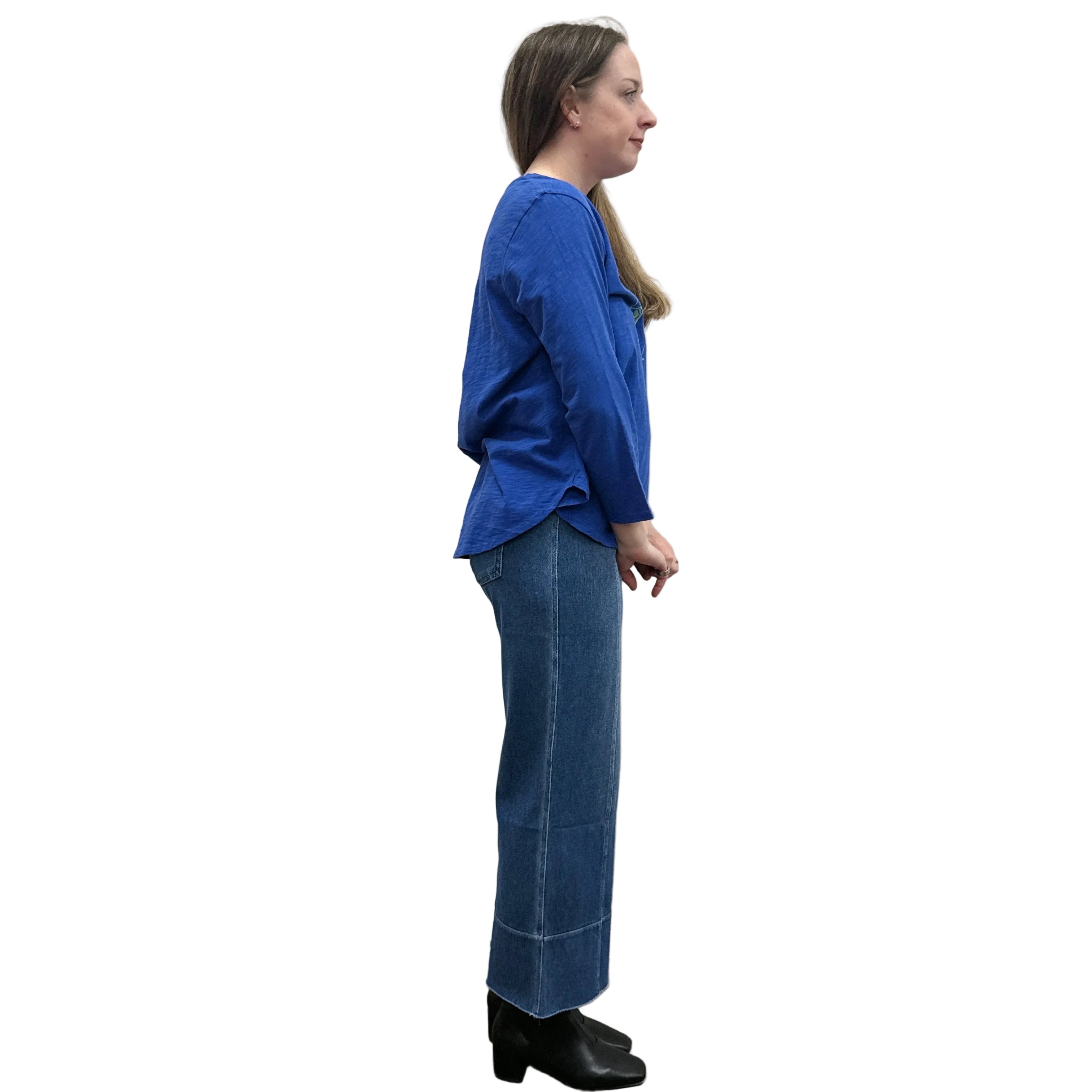 Person wearing a blue Papa High Low longsleeve top and jeans on a white background. 