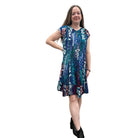 Woman wearing the Papa Indigo Mosaic Breeze patterned dress against a white background.