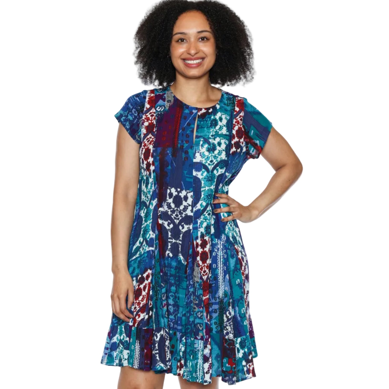 Woman wearing a multi coloured blue knee length indigo mosaic breeze papa style P5844 dress with a white background