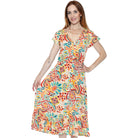 Woman wearing a colorful patterned dress on a white background