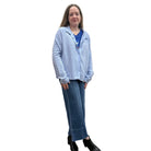 Person wearing a blue Papa Snappy Jacket sweater and jeans on a white background. 