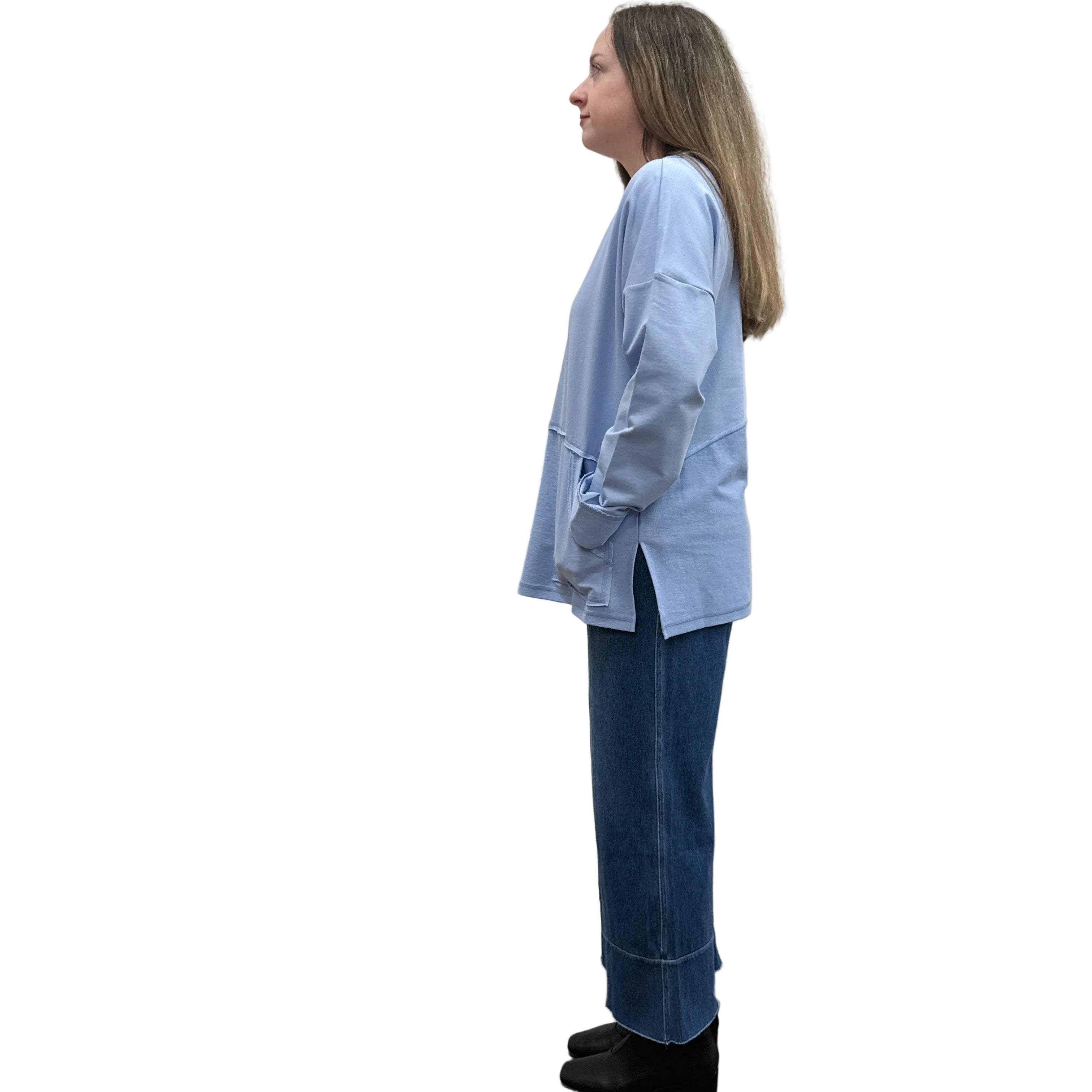 Person wearing a blue Papa Weekend Pullover sweater and jeans on white background. 