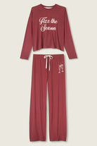 Burgundy pajama set with 'Fizz the Season' text on a white background