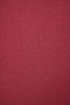 Solid burgundy color swatch with a textured pattern