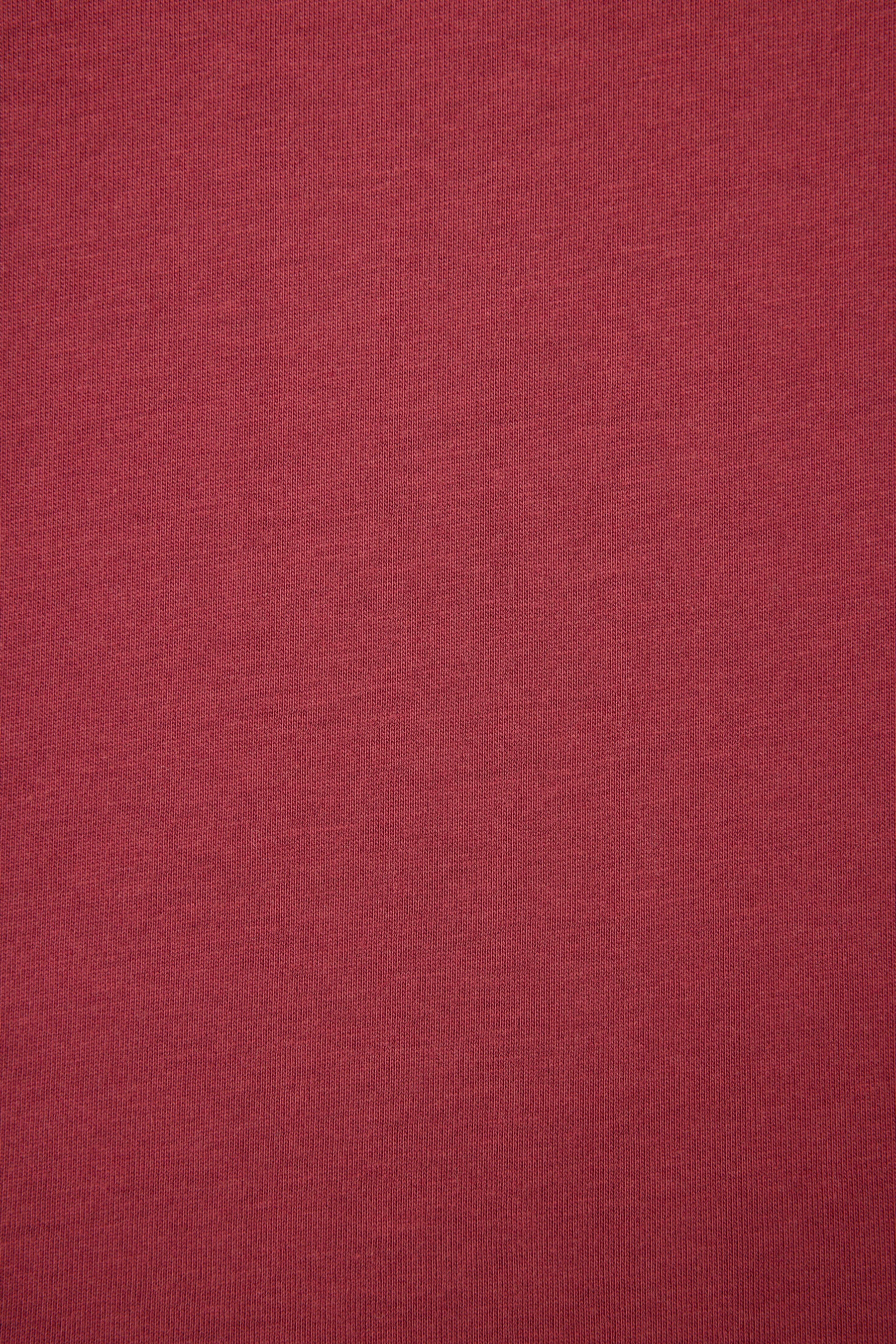 Solid burgundy color swatch with a textured pattern