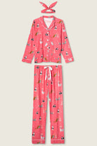 Pink pajama set with animal print on a light beige background