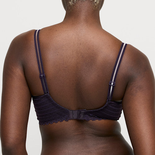 Bra worn by a person on a plain background