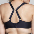 Black bra with unique back design on a neutral background
