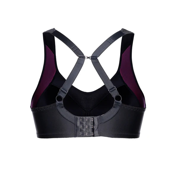 Black sports bra with purple accents on a white background